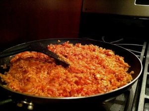 Add tomato sauce and stir in rice