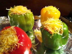 Fill peppers evenly and top with shredded cheese